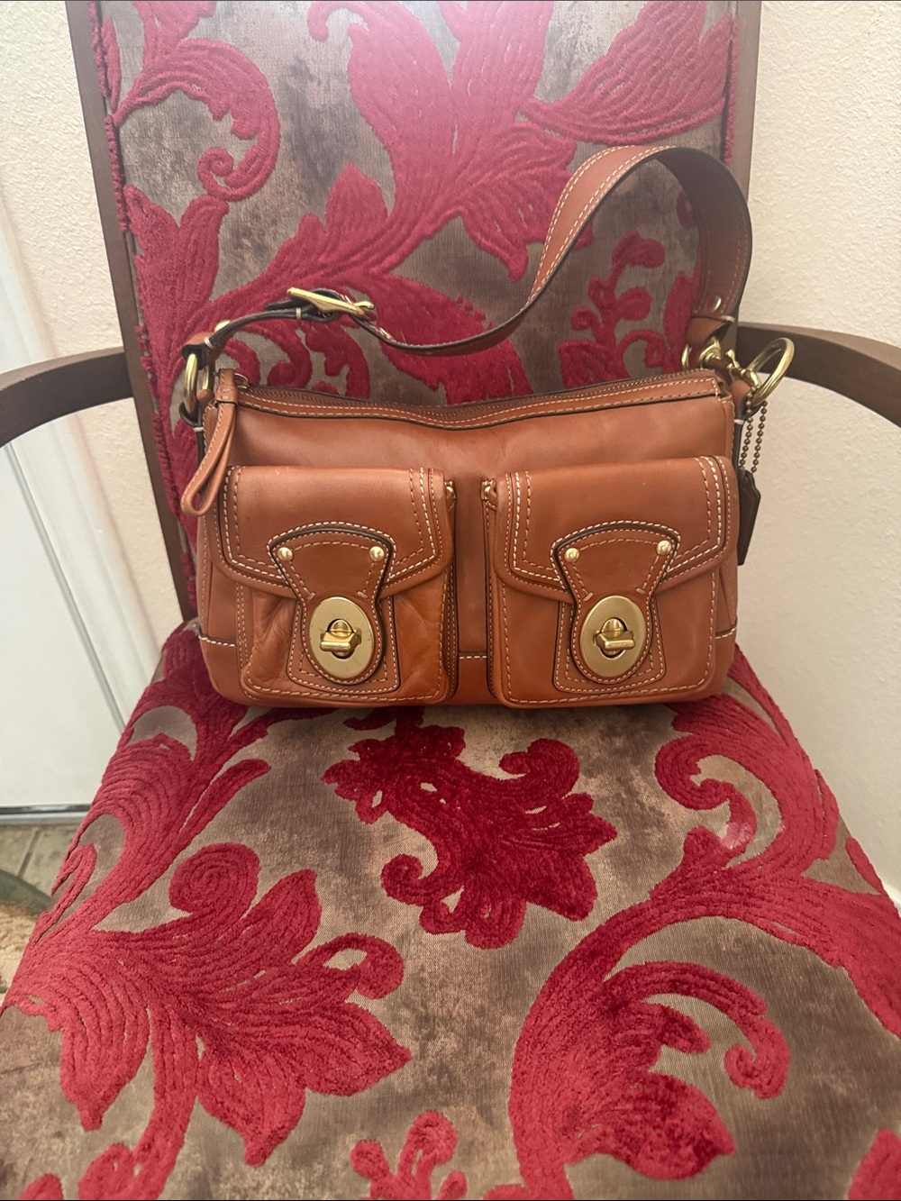 vintage Coach Legacy 65th Anniversary shoulder bag featuring whiskey brown leath
